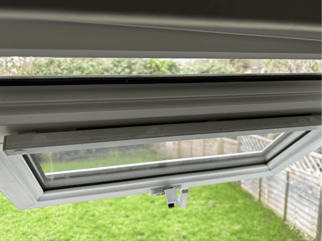 shows an open window and a close up of its trickle vent, a small gap can be seen between it and the main window frame